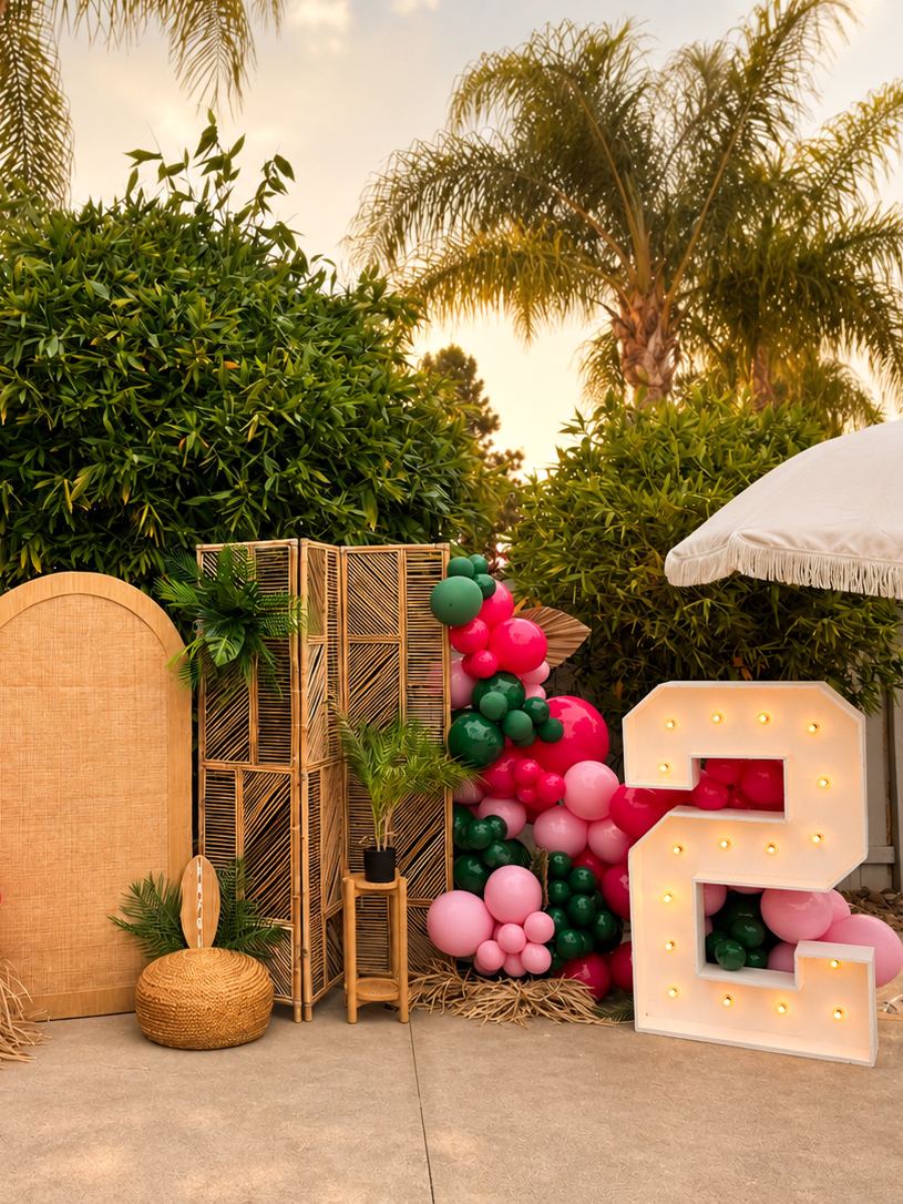 Boho backdrop panels and balloon garlands at golden hour