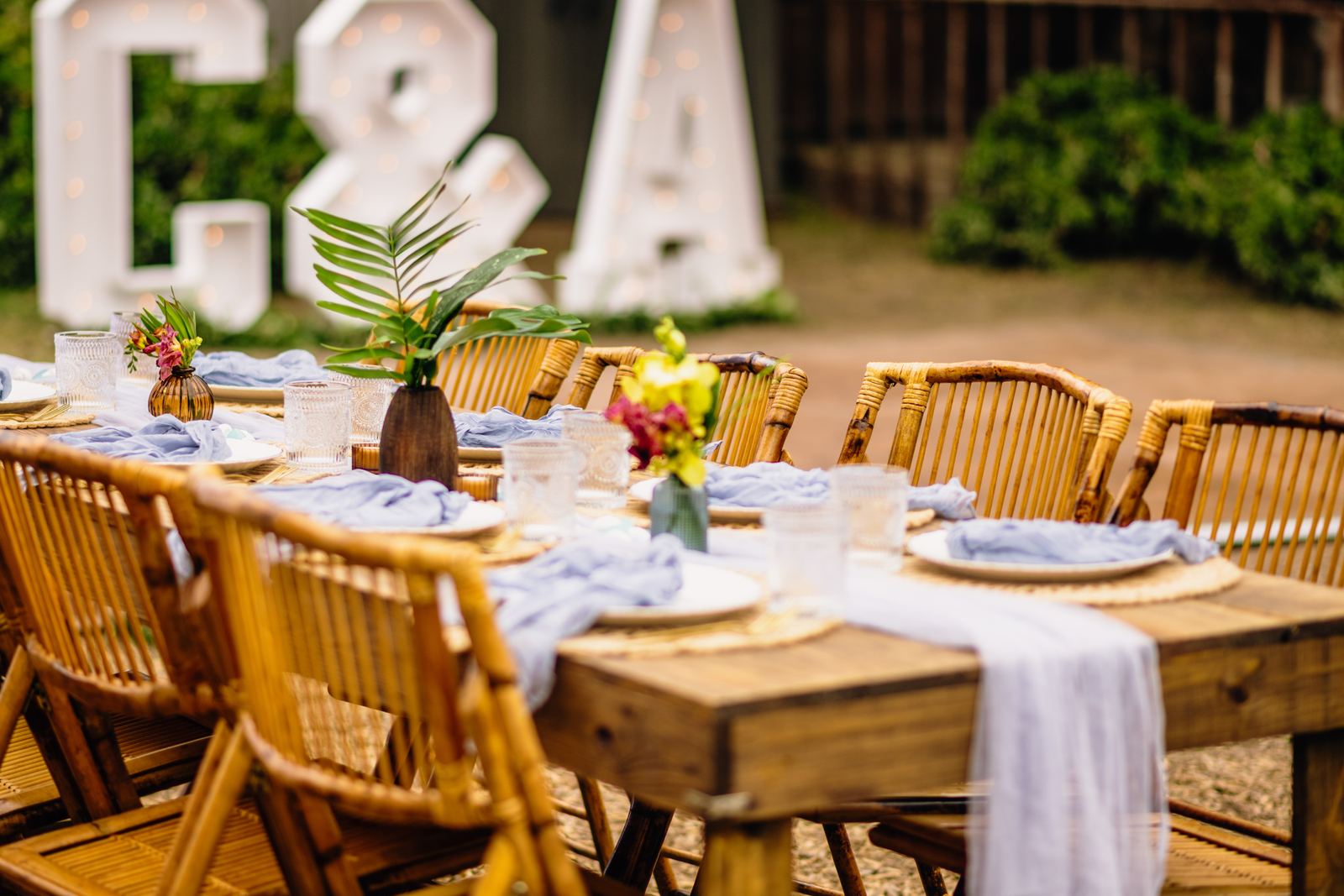 Marquee initials behind a styled dinner table