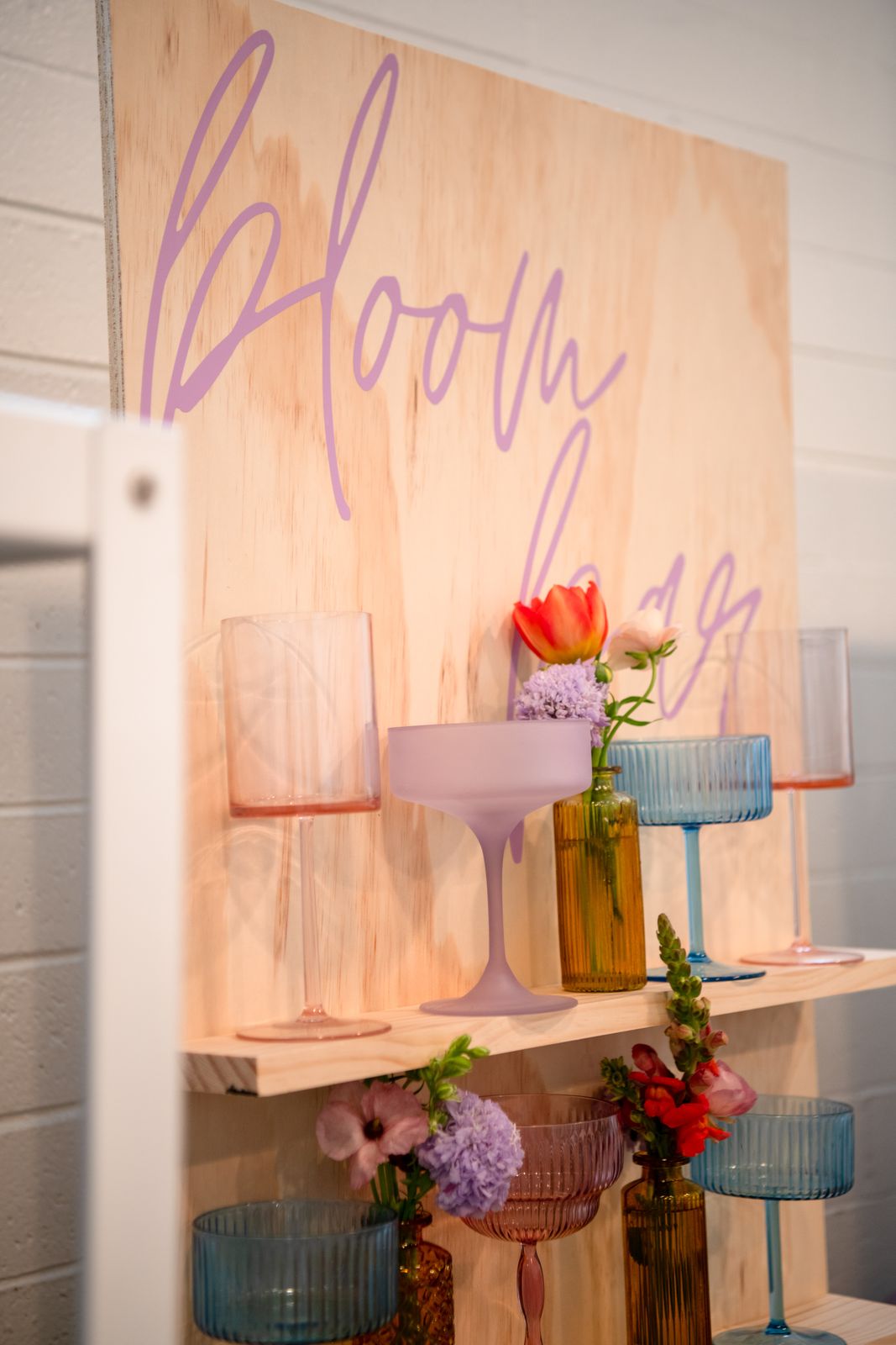 Bloom bar station with fresh flowers and glass vases