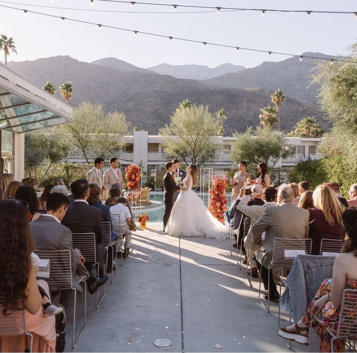 Outdoor wedding ceremony aisle with florals and mountain views