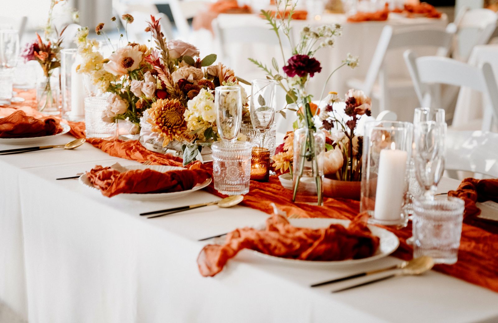 Terracotta and rust wedding tablescape with garden centerpieces