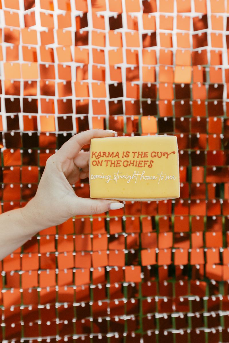 Orange shimmer wall with a custom cookie in front