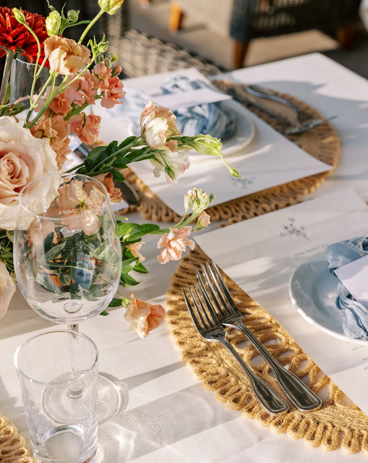 Place setting with a blue linen napkin and printed menu