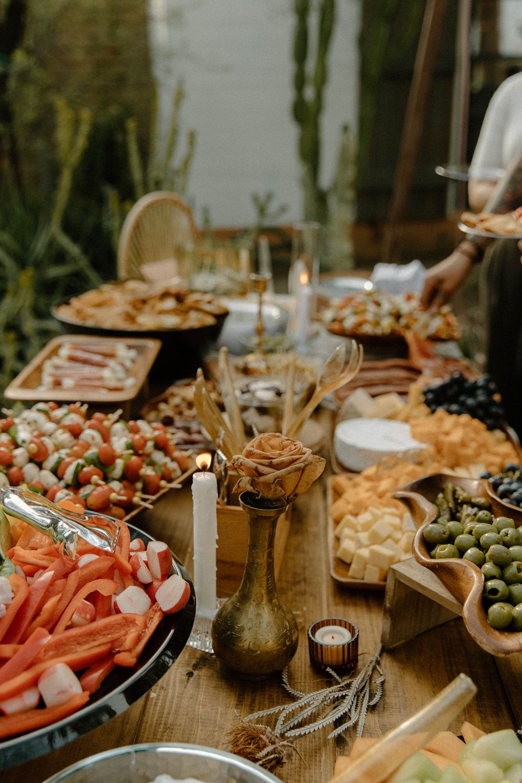 Couple cutting their cake at a desert reception